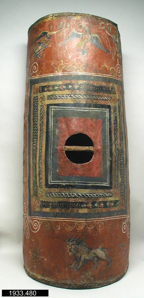 An archival photograph of a curved rectangular Roman shield, its painted surface worn but visible.